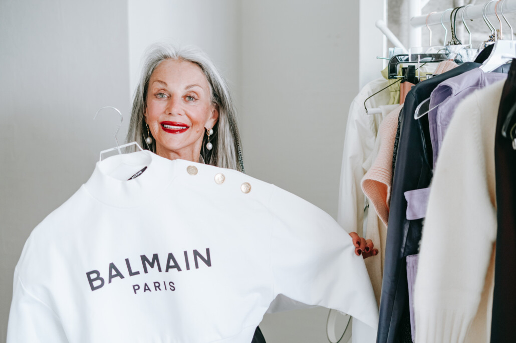 Honey Good holds up Balmain Paris sweater showing her style after 50