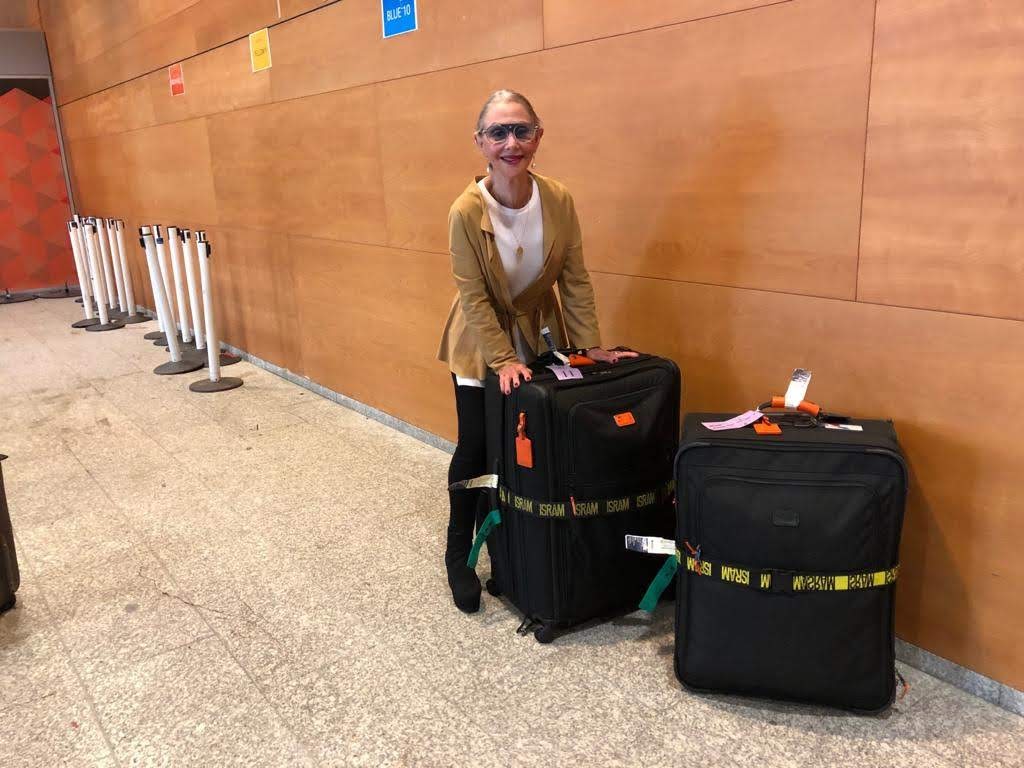 Image of Honey Good leaving for a trip with two packed suitcases while talking about "before leaving for a trip drivers should check"