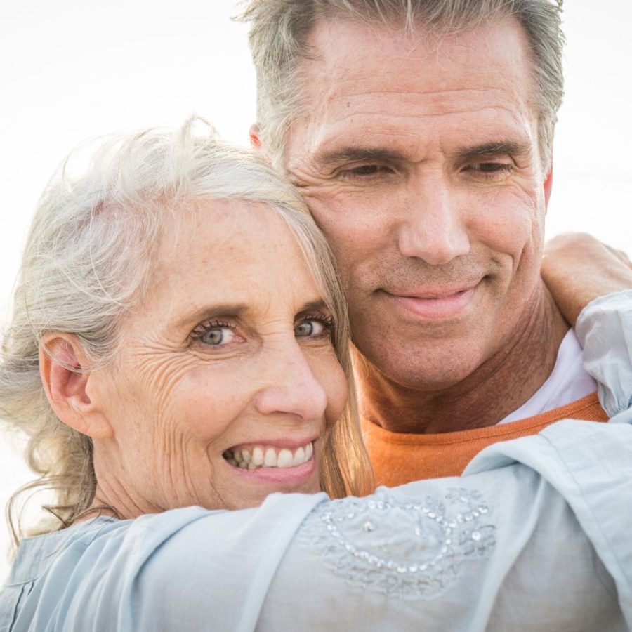 two seniors dating while smiling 