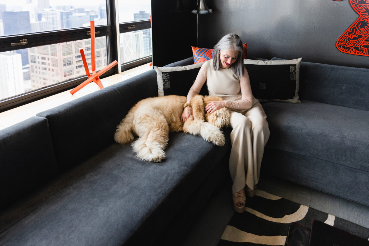 Honey Good and her dog America Good on a couch