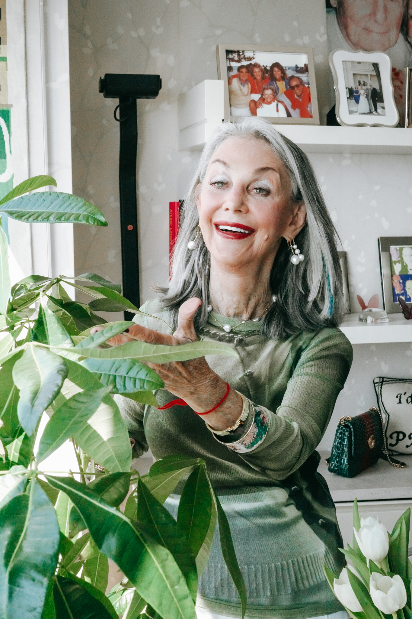 Honey Good smiling, showing off her plant chatting about relationships with other women