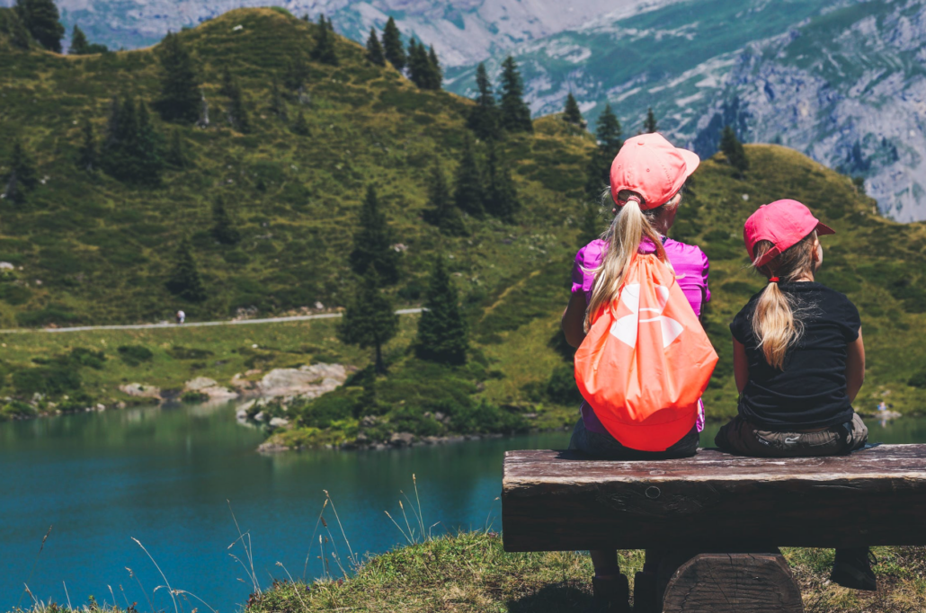 woman and young girl out for hike having fun outside with grandchildren