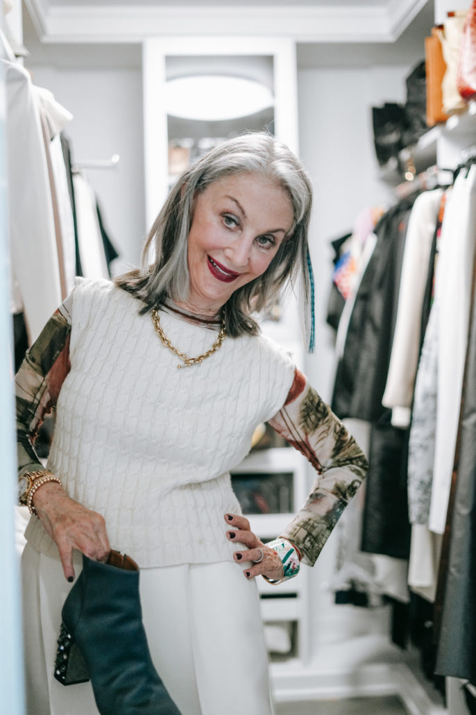 Honey Good standing with her hand on her hip in her organized closet