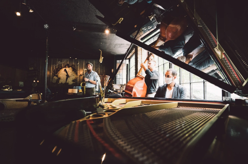 Image: view of band through open piano top in Le Piano, best places to visit in Chicago