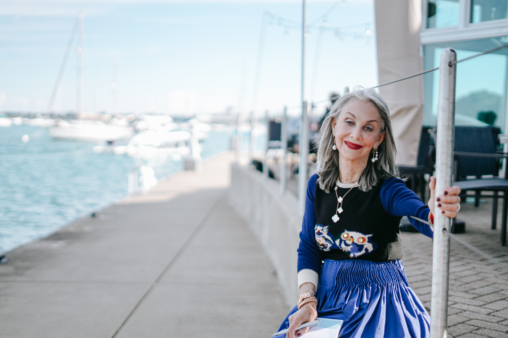 Honey Good smiling next to Lake Michigan contemplating less is more