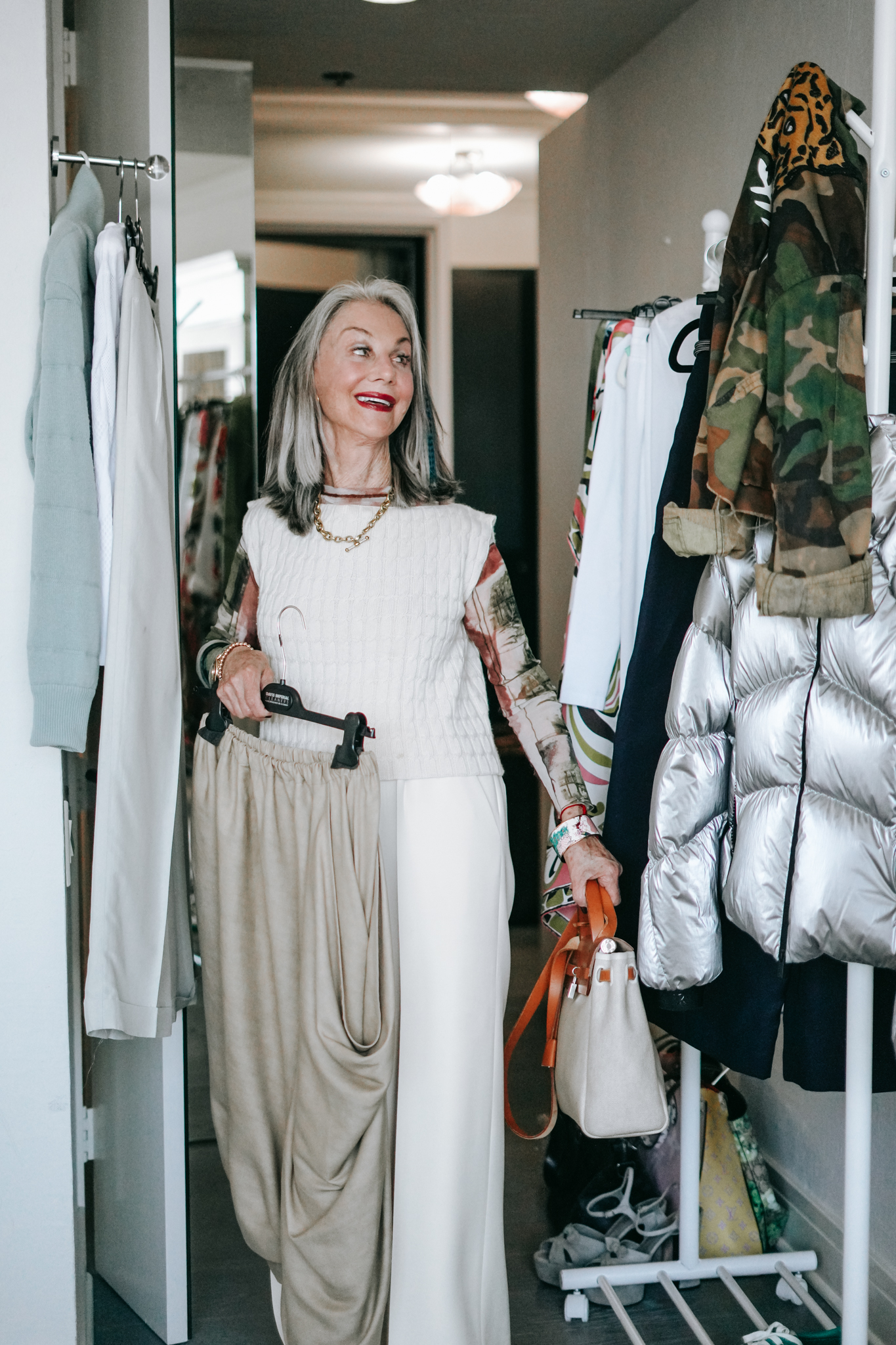 Honey Good smiling in her element - choosing clothing for a photo shoot