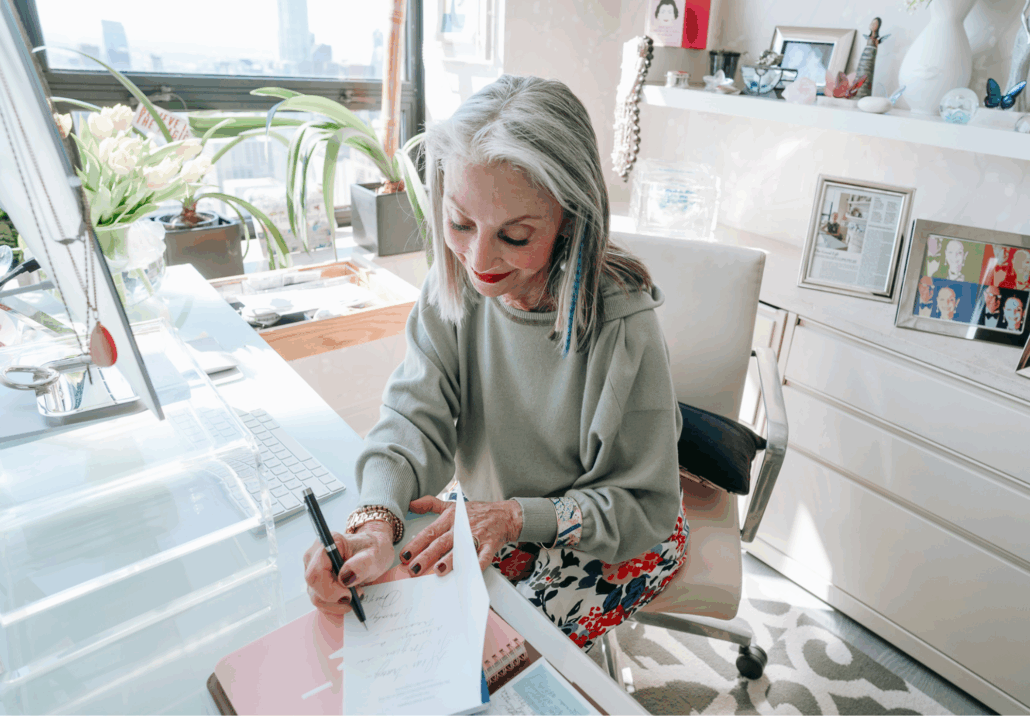 a photo of Honey performing an act of kindness, writing a hand written letter