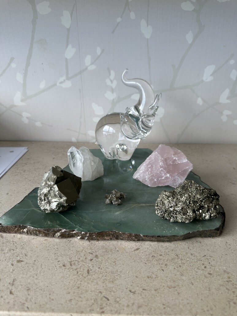 several different cystals on a natural marble base