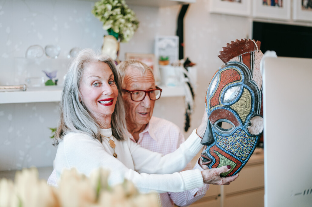 Honey and Shelly Good smiling with African mask, safe travel after 50