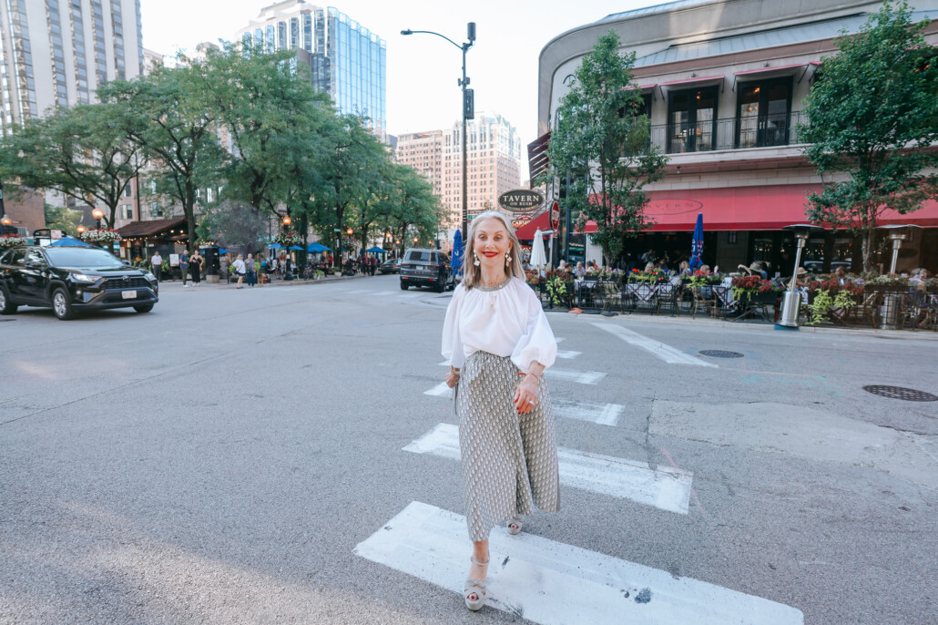 Honey Good standing in the road in Chicago, reinventing herself with blue nail polish