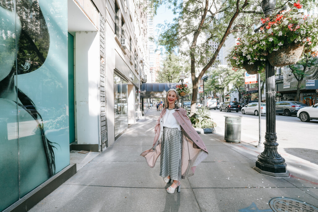 Honey Good next to a luxury shop front in Chicago understanding that a woman over 50 must reinvent ourselves.