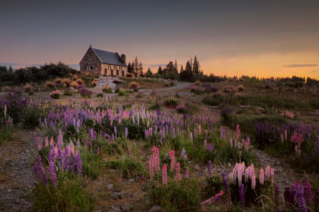 solo travel for women over 50 New Zealand at sunset Lake Tekapo