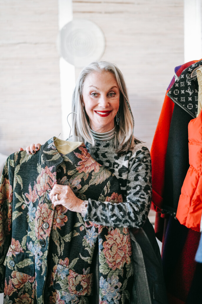 Honey Good holds a coat showing off style and fashion and the difference between the two