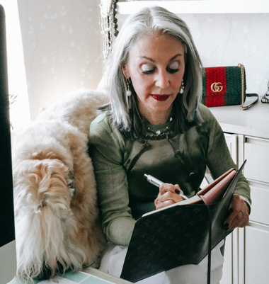 a photo of Honey and America journaling at her desk