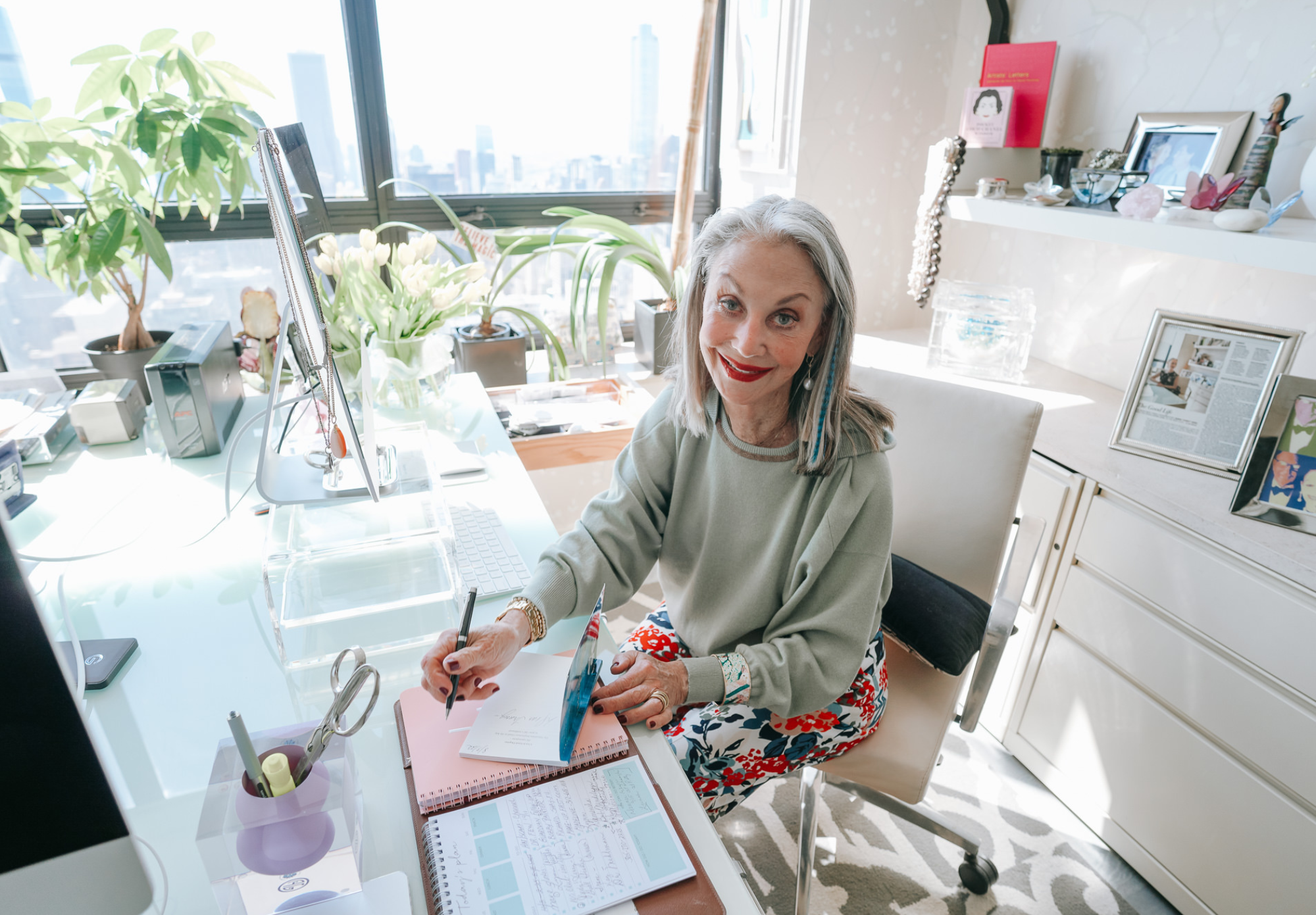 a photo of Honey writing in her office